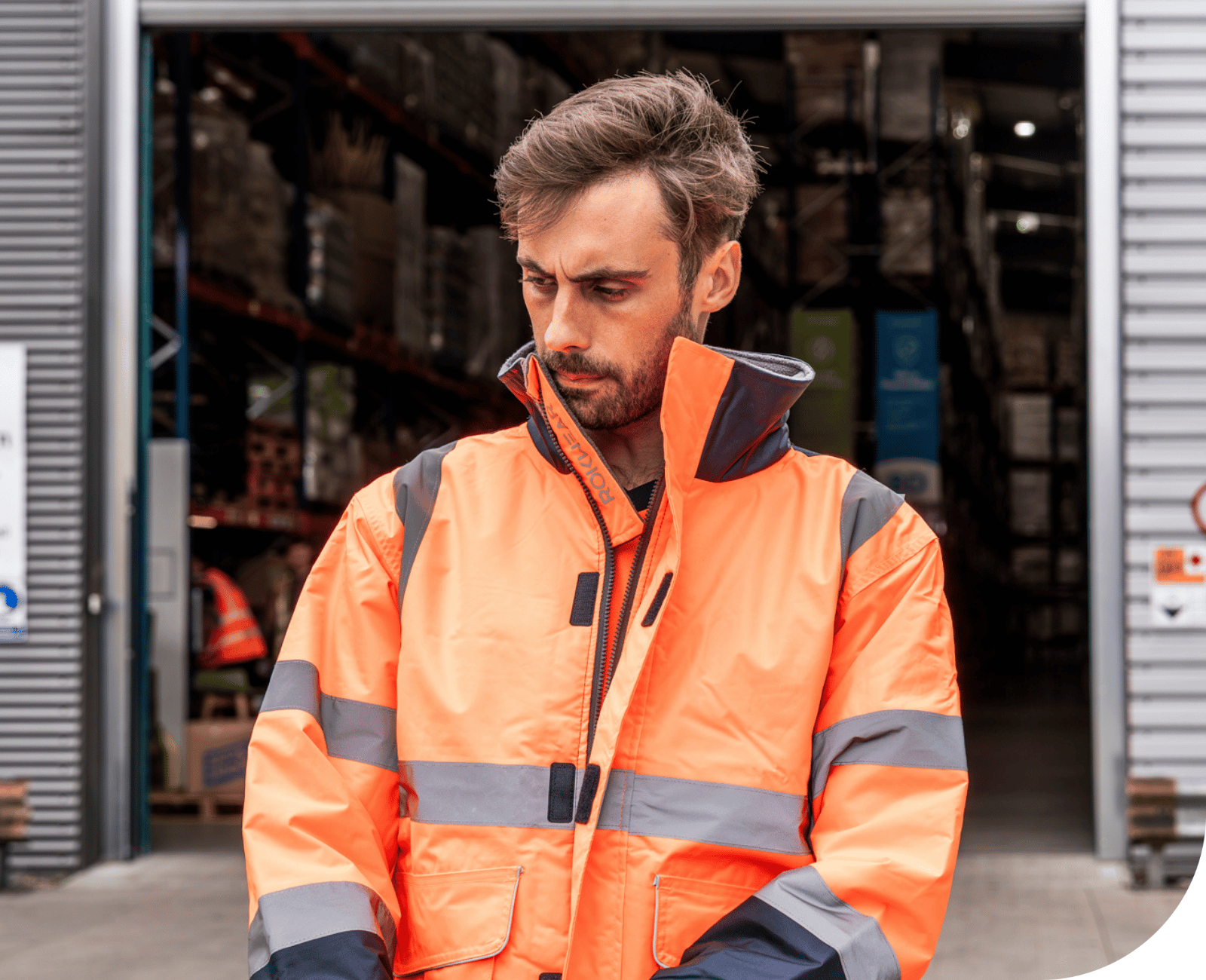 Man wearing RIS-3279-TOM certified orange hi-vis jacket