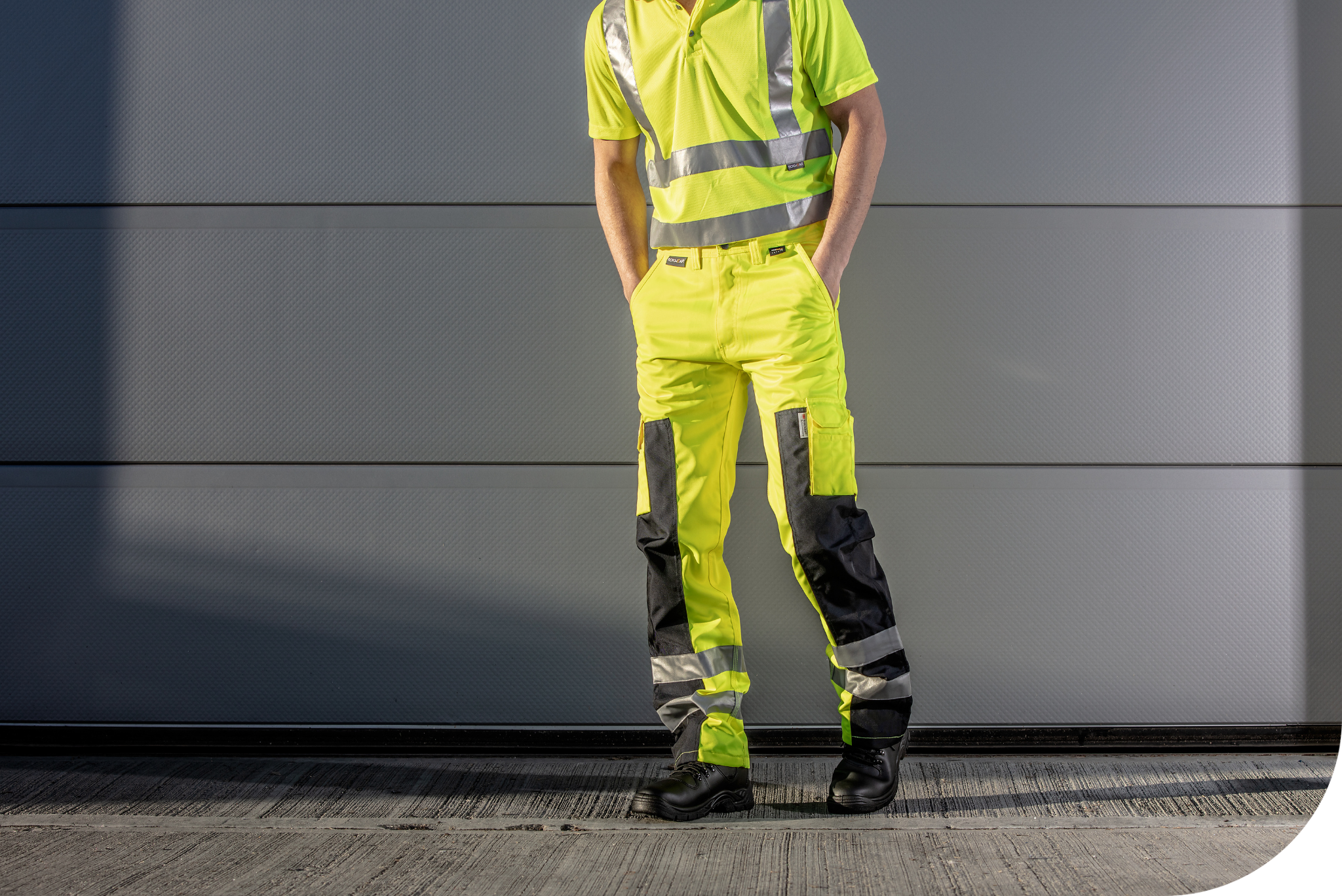 Man wearing hi-vis yellow trousers.
