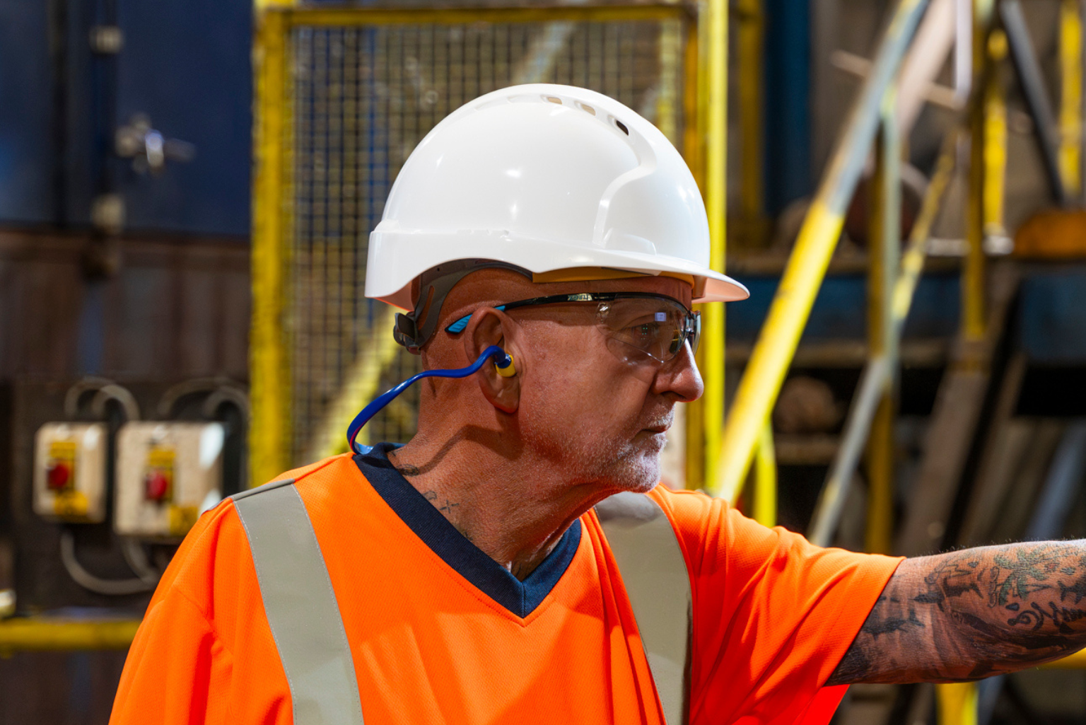 Man wearing head PPE.