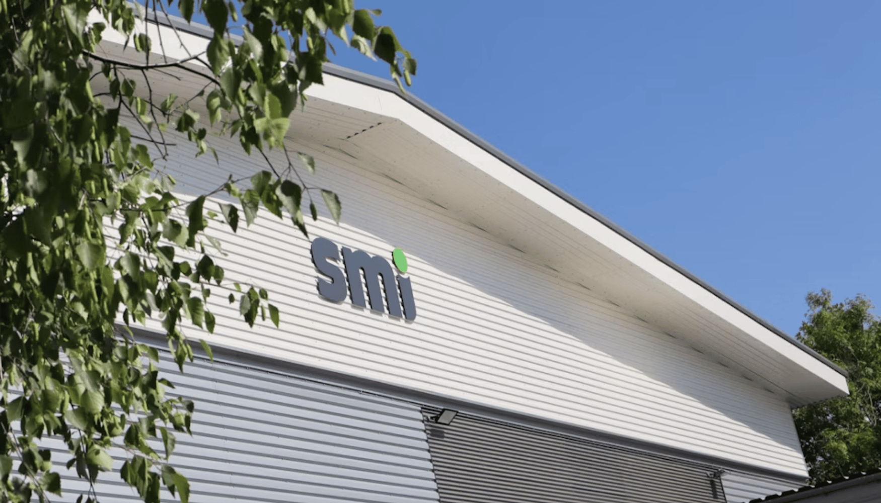 SMI Logo sign on building