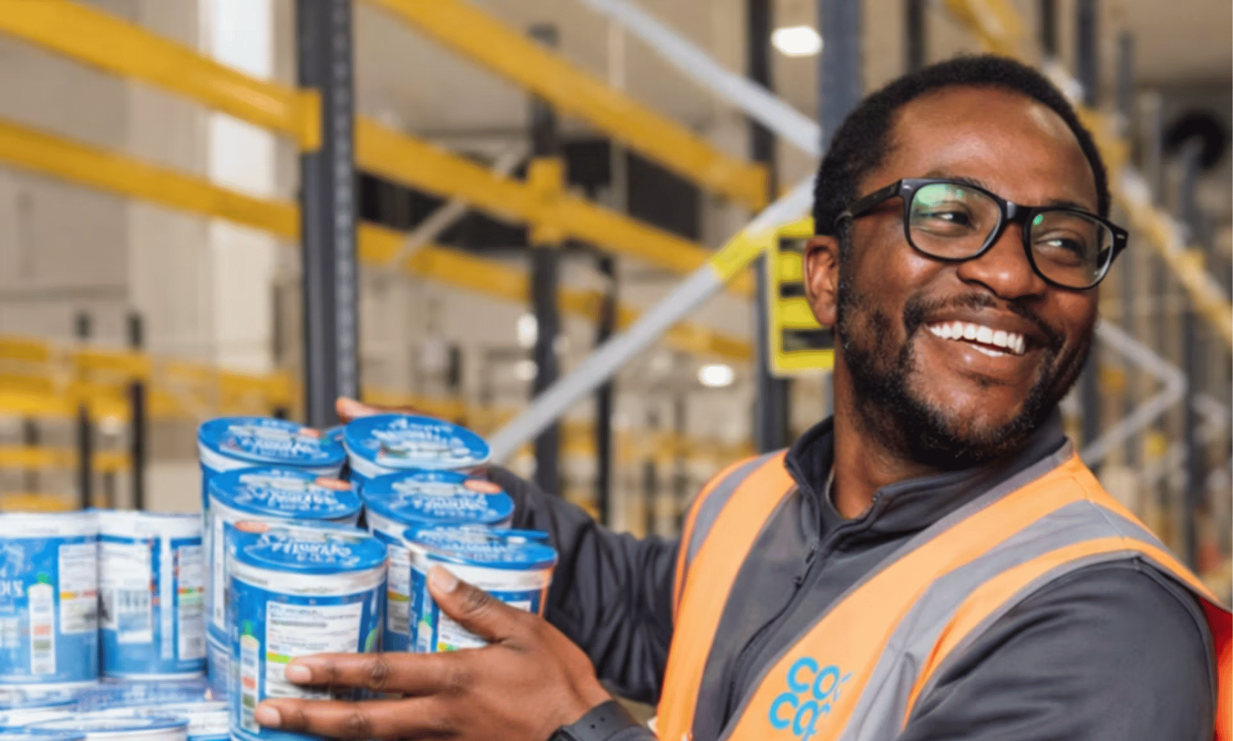 Co-op worker wearing a branded hi-vis vest.